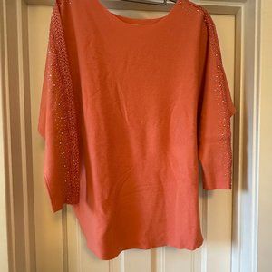 Never worn! Beautiful orange sweater with beaded, cut-out sleeve details